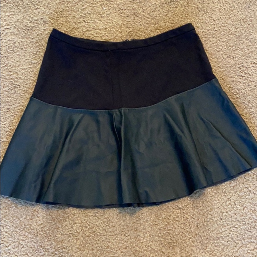 Black and leather on the bottom skirt.
